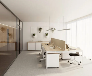 Lifestyle image of Buronomic Nuanza desks with round arch leg and pedestals in a white office