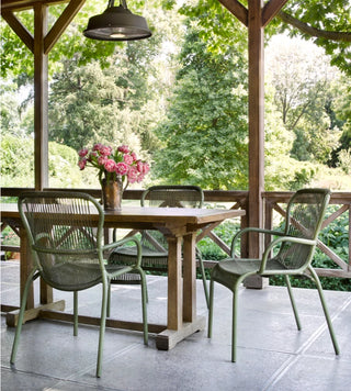 Vincent Sheppard Loop outdoor dining chair in moss, lifestyle image
