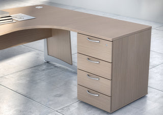 Buronomic Comfort four-drawer desk-height pedestal in wire oak with top extension on a desk