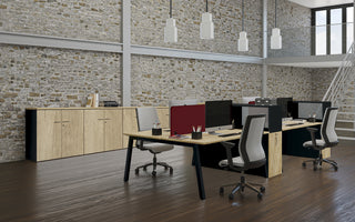 Lifestyle image of Buronomic Optimax EVO towers in black and Nebraska in a brick loft