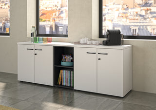White Buronomic Quietude low cabinets with hinged doors and black open column by the window