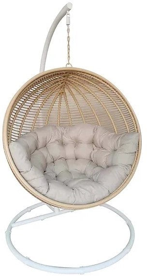 EGGO hangstoel naturel rattan met beige kussen en wit stalen frame vrijstaand