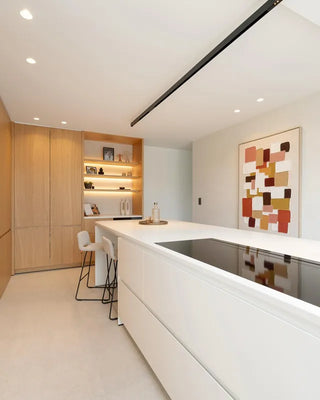 Lifestyle image of a white kitchen with Mobitec Pamp bar stools at the island