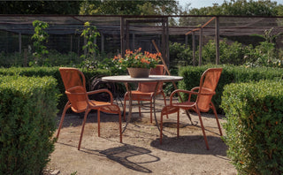 Vincent Sheppard Loop outdoor dining chair in terracotta, lifestyle image