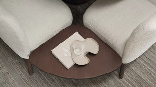 Detail of two ecru Mobitec Thalia armchairs with side table, top view