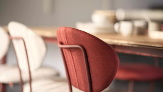Detail of a red Mobitec Toro chair back at a table